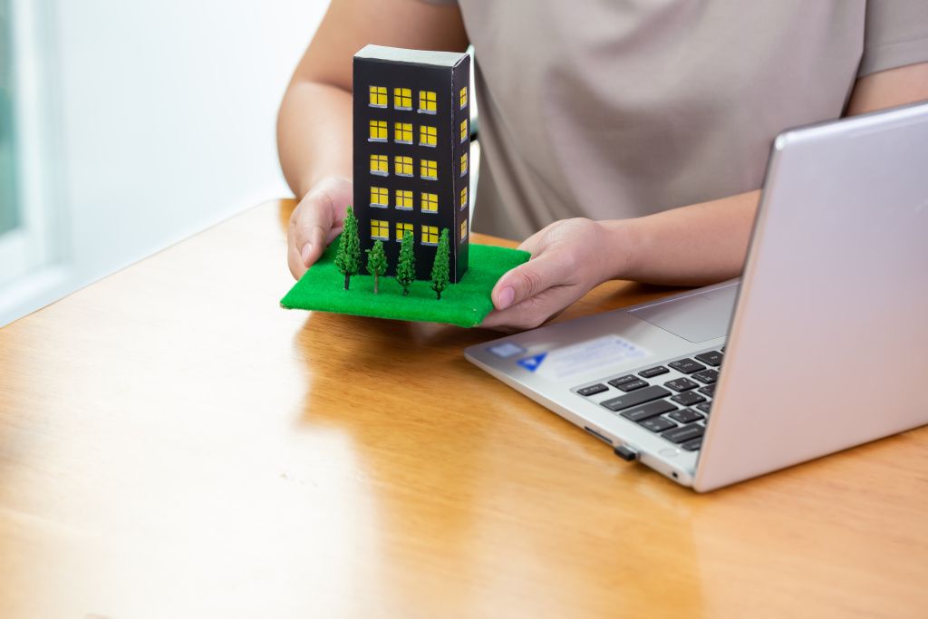 woman-fills-out-information-computer-submit-condo-loan-bank.jpg