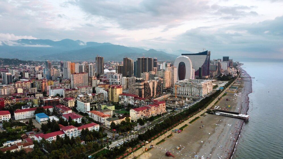 aerial-drone-view-coastline-batumi-georgia-black-sea-buildings-greenery-mountains_1268-18383.jpg