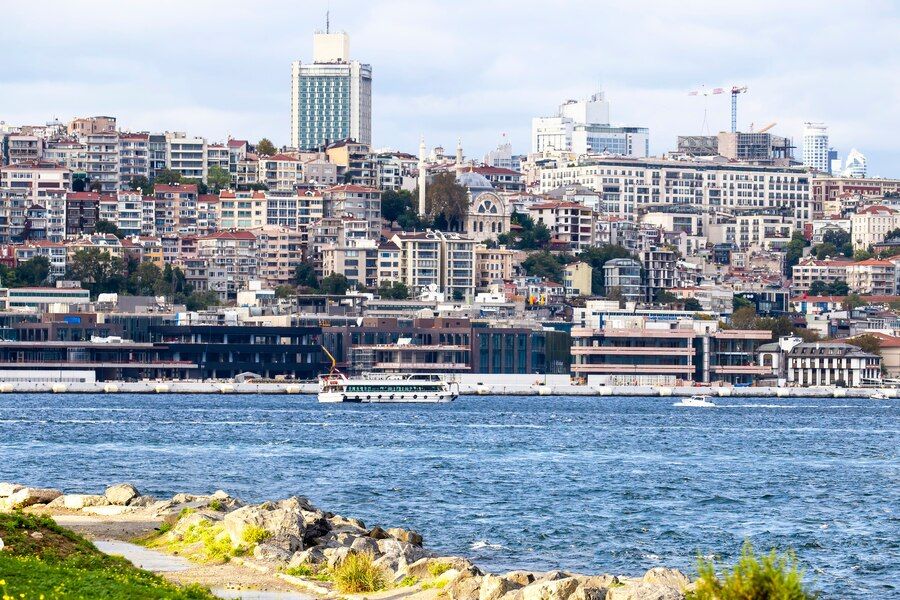 view-district-with-residential-high-modern-buildings-istanbul-bosphorus-strait-with-boats-people-resting-shore-turkey_1268-16433.jpg