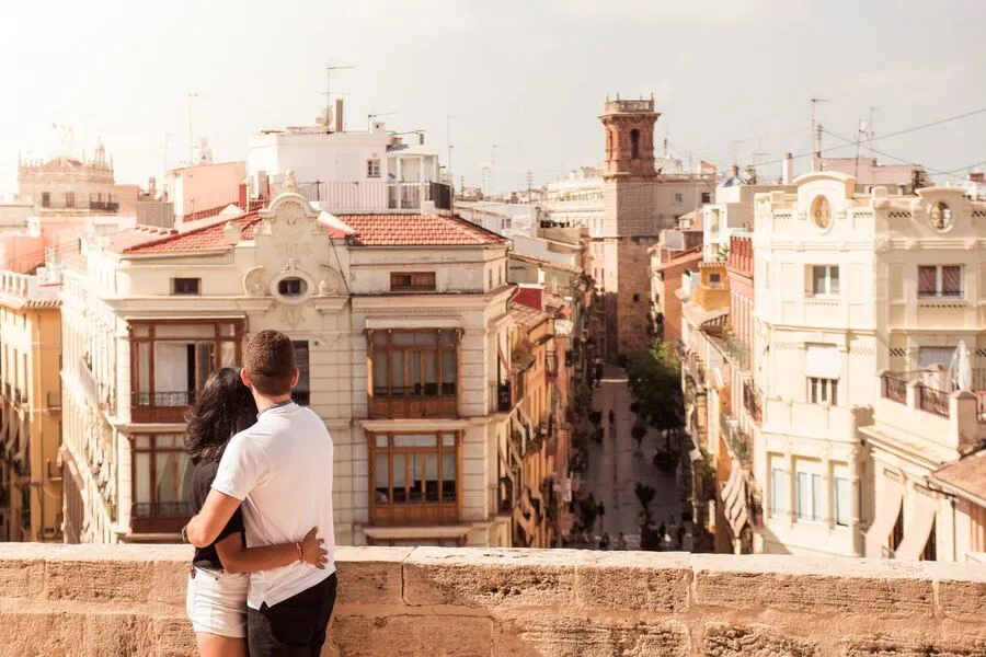 back-view-young-tourist-couple-looking-out-buildings-city_181624-39924.jpg
