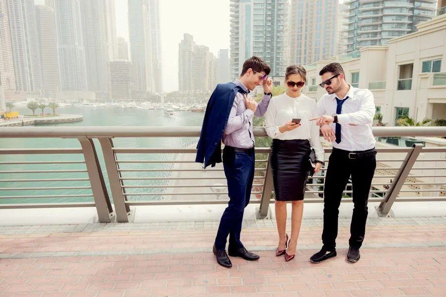 group-business-people-talking-outside-looking-mobile-phone_232070-272.jpg