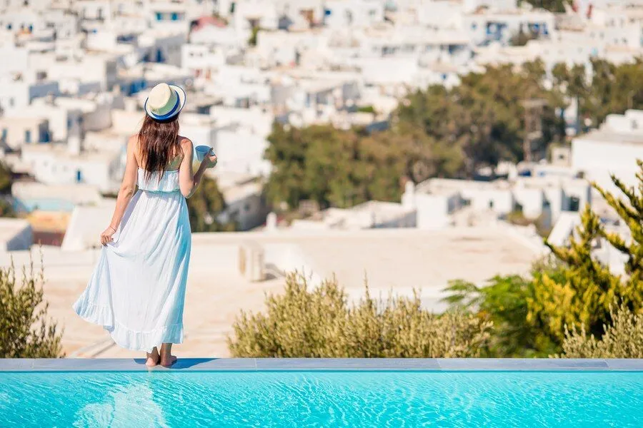 woman-relaxing-by-pool-luxury-hotel-resort-enjoying-perfect-beach-holiday-vacation_109800-15460.jpg